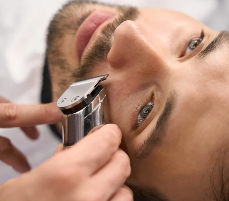 serious-man-not-moving-while-barber-trimming-his-m-2025-03-05-20-28-21-utc